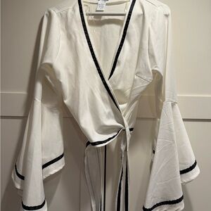 Elegant White Wrap Top with Black Trim